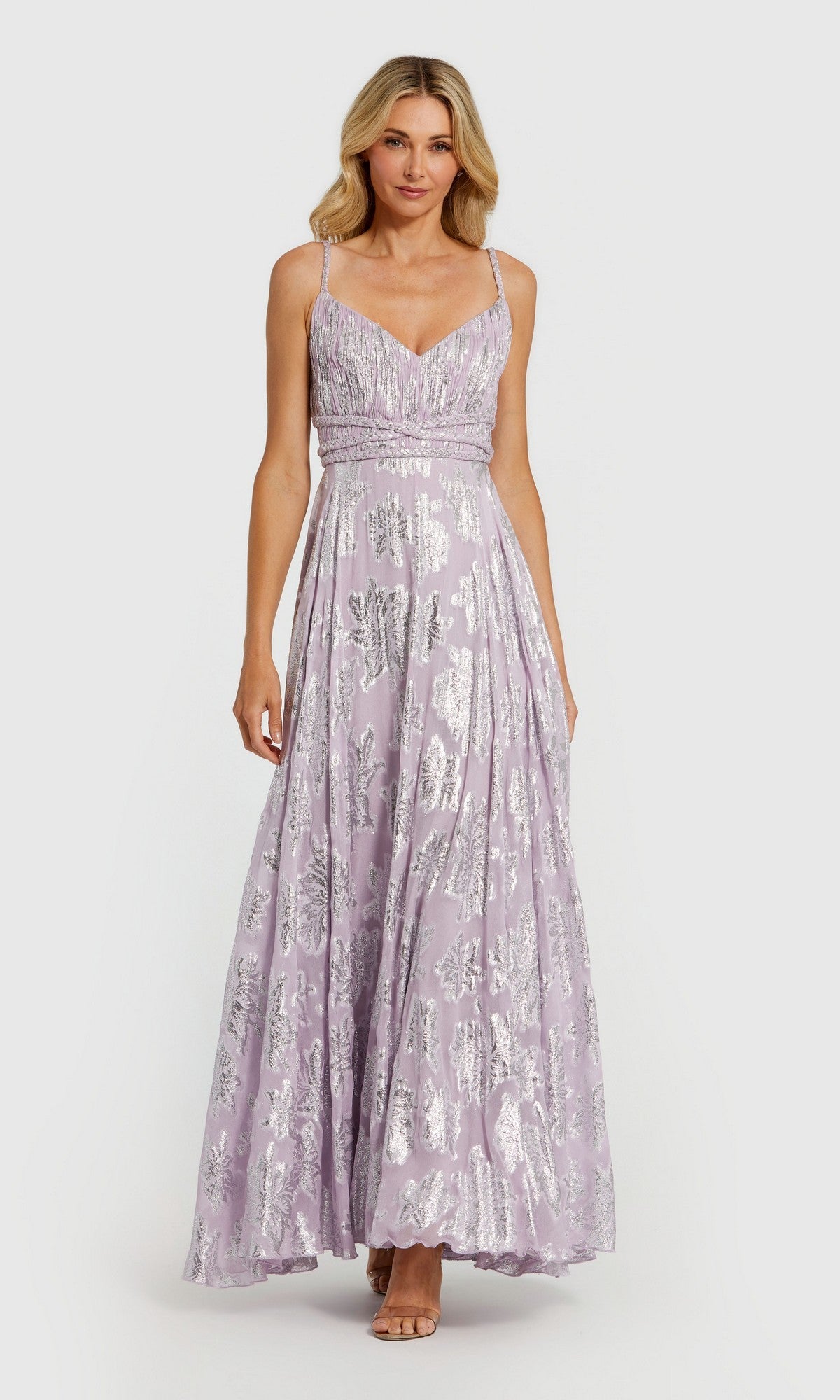 A woman models the Mac Duggal 9310, a long lilac multi formal dress with silver floral detailing and spaghetti straps, set against a plain light background.